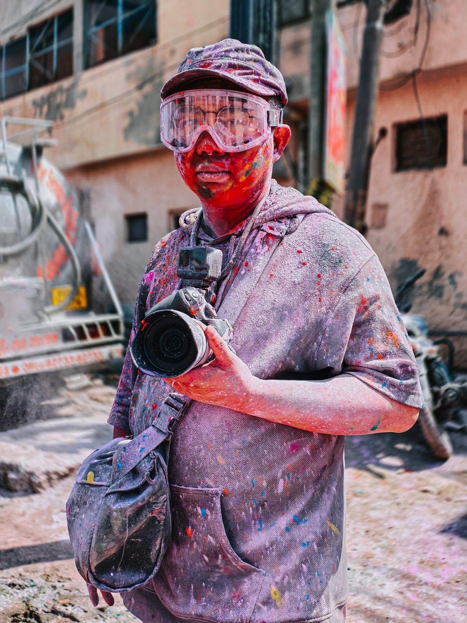 Photographer covered in colors at Holi festival in India